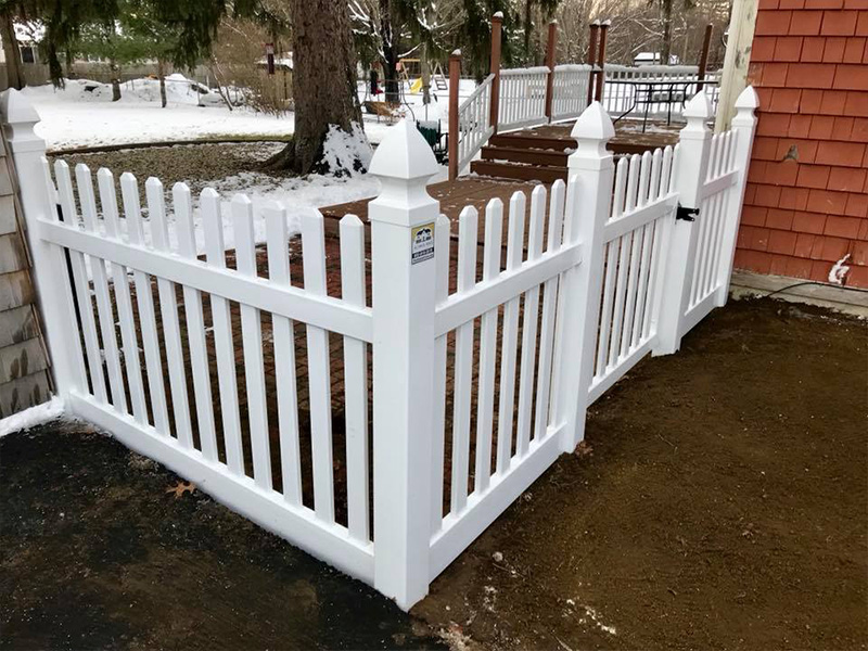 Commercial white picket vinyl fence in Derry New Hampshire